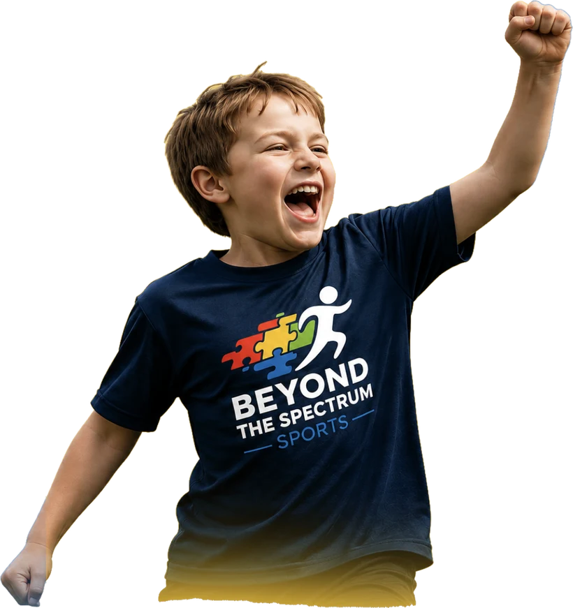 A cheering boy in a Beyond the Spectrum Sports shirt, fist raised